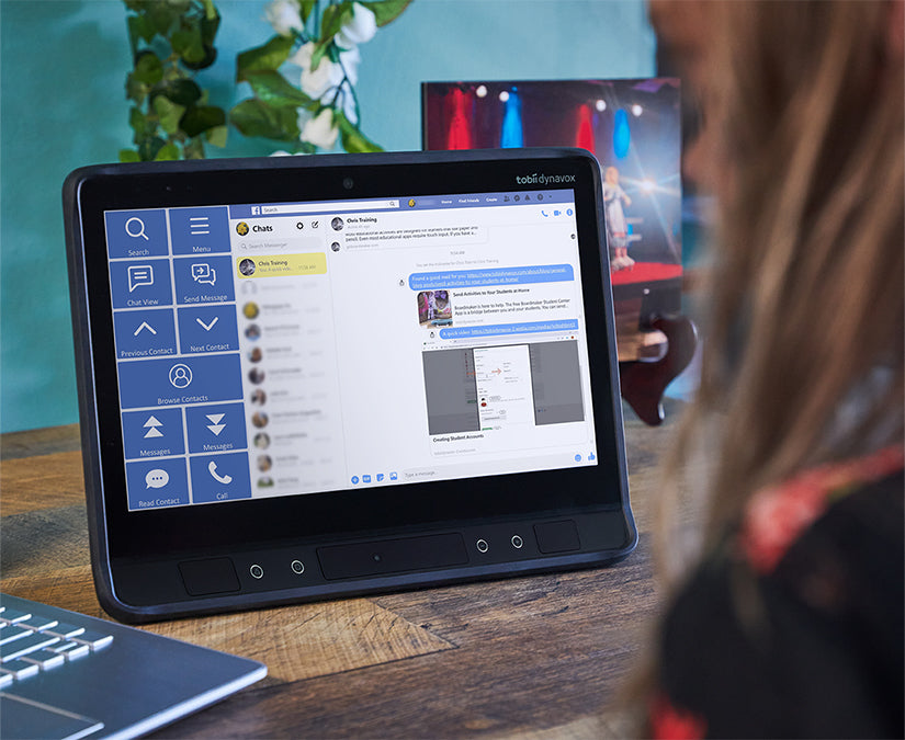 Woman using Tobii Dynavox Communicator 5 Accessible Facebook on an I-Series SGD