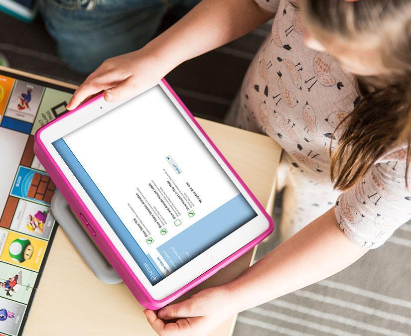 Girl using ipad and Tobii Dynavox software Snap Scene