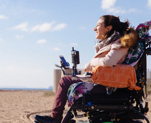 Woman using Tobii Dynavox AAC device outside