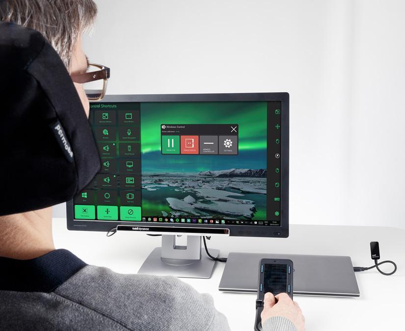 Person controlling his desktop using the Tobii Dynavox PCEye Plus eye tracker